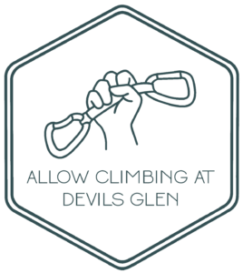 Allow Climbing at Devil's Glen graphic depicting a raised fist holding a quickdraw. designed by Michelle Ang.